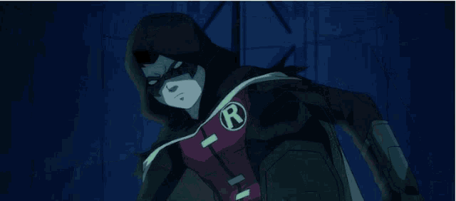 a cartoon character is laying on the ground in a dark room