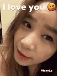 a close up of a woman 's face with the words `` i love you '' written above her head .