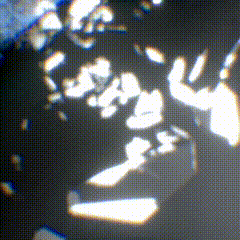 a close up of a black background with white spots