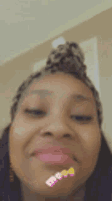 a close up of a woman 's face with a filter on her face .