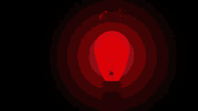 a light bulb is lit up in the dark
