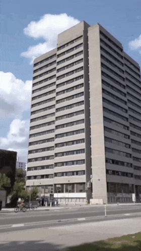 a very tall building with a blue sky in the background