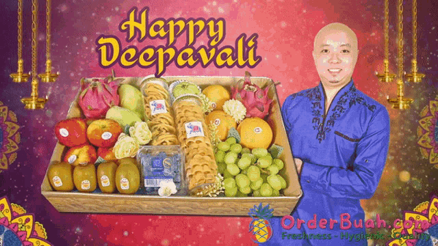 a man in a blue shirt stands in front of a tray of fruit and cookies