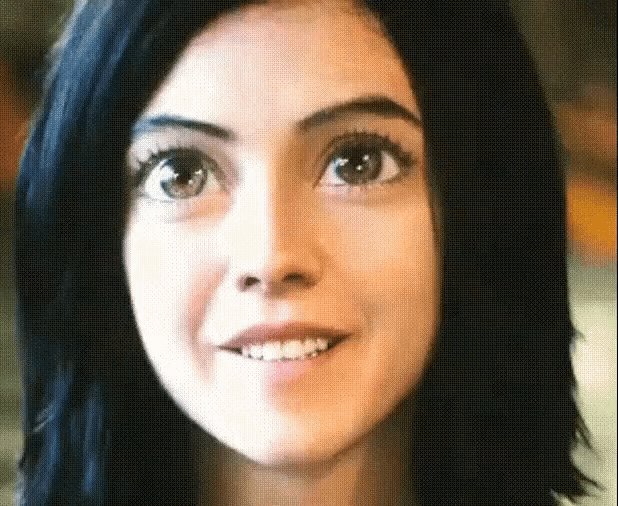 a close up of a woman 's face smiling