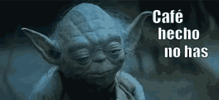 a close up of yoda from star wars with the words `` cafe hecho no has '' above him .