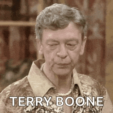 a man wearing a pearl necklace and a floral shirt is making a funny face and saying terry boone .