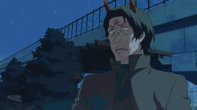 a man is being attacked by a green monster with horns