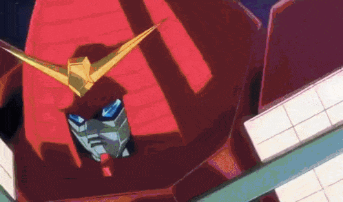 a red robot with a yellow wing is standing in front of a building in a cartoon .