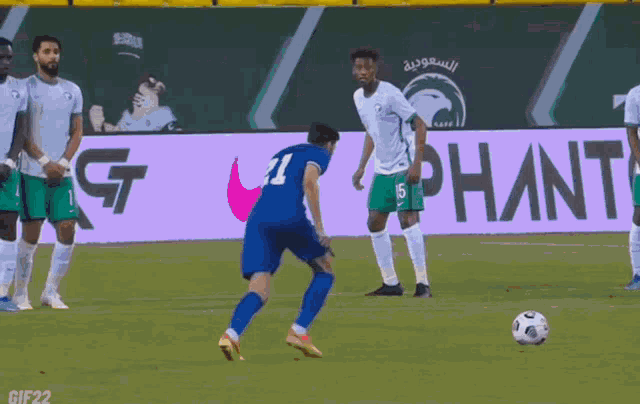 a soccer player in a blue jersey with the number 21 on it