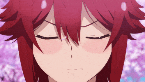 a close up of a girl 's face with her eyes closed