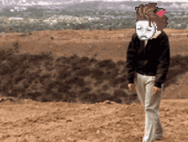 a pixelated image of a person with a mask on their head