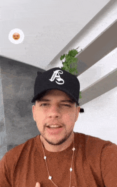 a man wearing a black hat that says ' supreme ' on it
