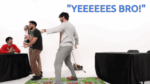 a group of men are playing a game and one of them is saying " yeeees bro "