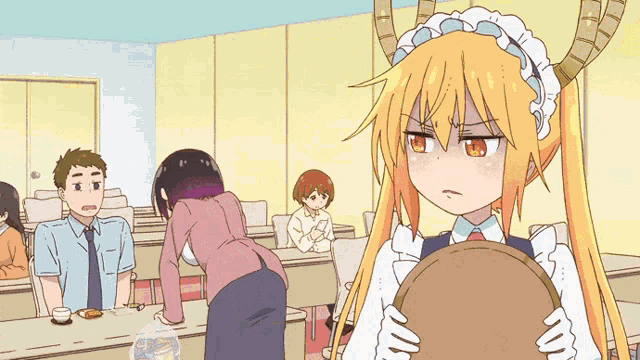 a girl with horns is holding a tray in a room