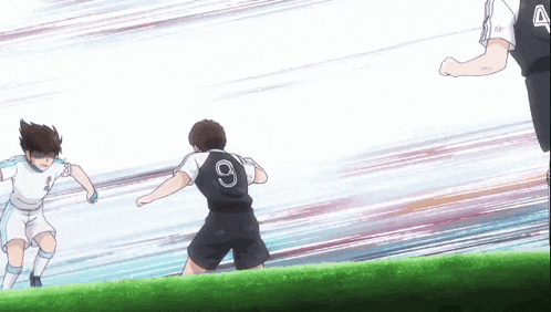 a soccer player with the number 9 on his jersey kicks the ball