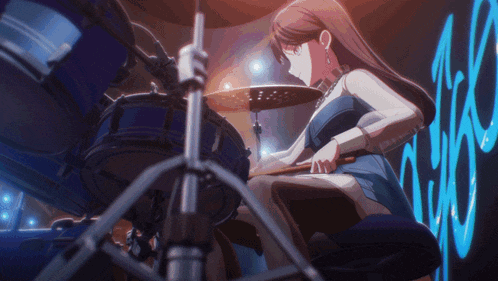 a girl in a blue dress is playing drums in front of a sign that says tsc