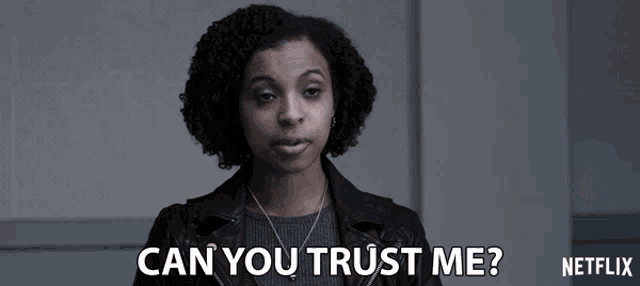 a woman in a black jacket says can you trust me