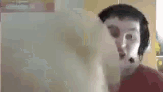 a blurry picture of a person 's face with headphones on