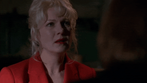 a woman in a red jacket says " no "