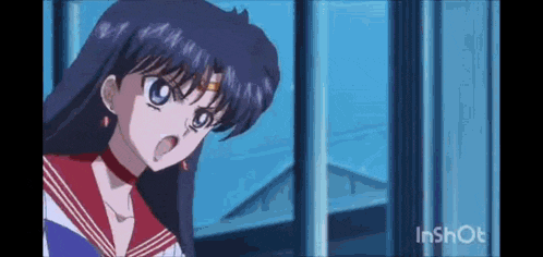 a girl is standing in front of a window with her mouth open .