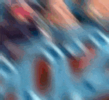 a blurred image of a person 's feet with a blue background