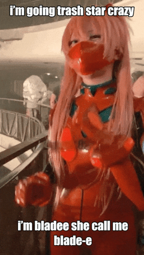 a woman in a red latex suit with a mask on her face says i 'm going trash star crazy