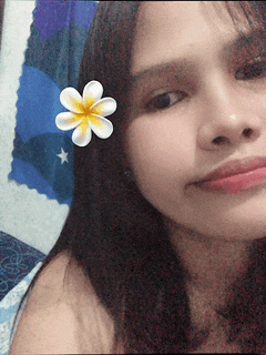 a woman with a flower in her hair