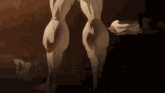 a statue of a man with a towel around his neck is standing in the dark .