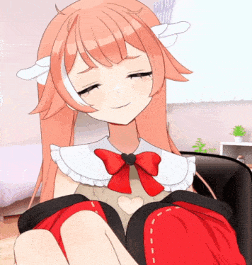 a girl with red hair and a red bow on her neck