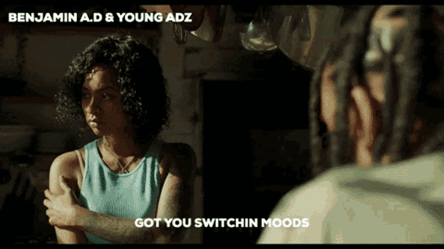 a woman looking at a man with the words got you switchin moods on the bottom
