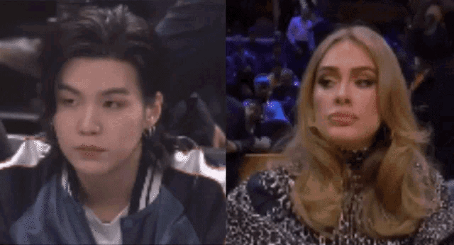a man in a blue jacket and a woman in a leopard print dress are sitting next to each other .