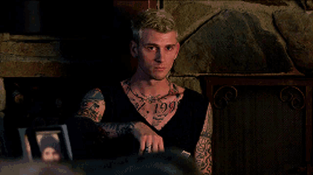 a man with a tattoo on his chest with the number 199 on it