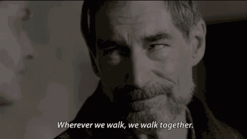 a man with a beard talks to another man and says wherever we walk we walk together