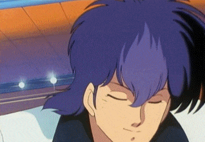 a close up of a person 's face with purple hair