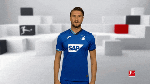 a man is wearing a blue shirt with the word sap on it