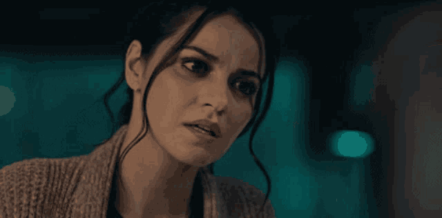 a woman with a serious look on her face