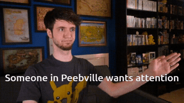 a man wearing a pikachu shirt says someone in peebville wants attention