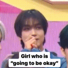 a girl who is going to be okay covering her mouth with her hand