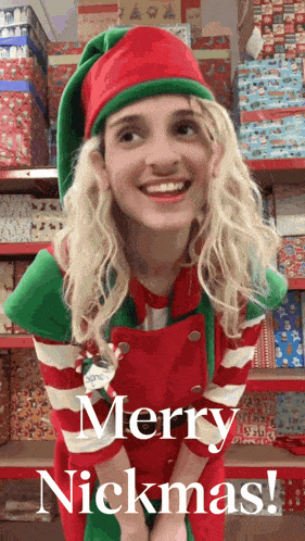 a woman dressed as an elf says merry nickmas on a card