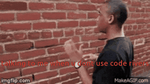 a man standing in front of a brick wall with the words " talking to me when u dont use code river " above him