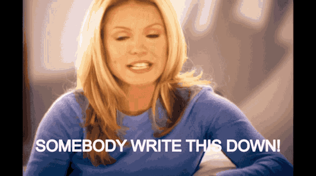 a woman in a blue shirt with the words somebody write this down below her