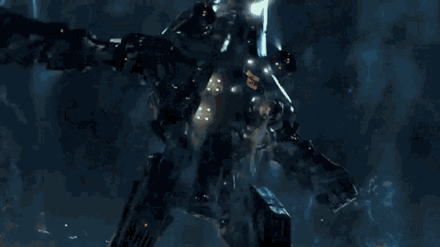 a close up of a robot with a gun in a dark room .