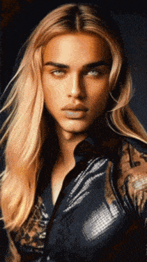 a close up of a woman 's face with long blonde hair