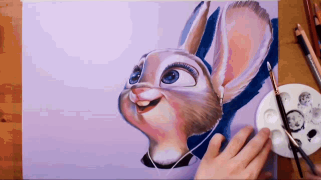 a person is painting a picture of a rabbit