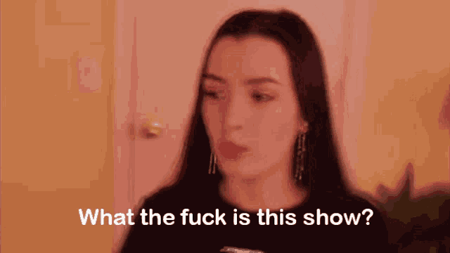 a woman says what the fuck is this show in front of a door