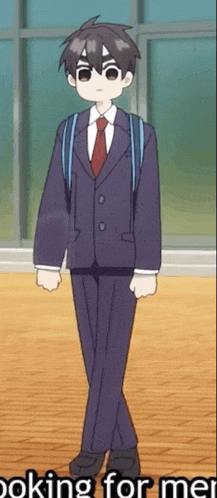 a boy in a suit and tie is standing in front of a window with the words " looking for me " below him