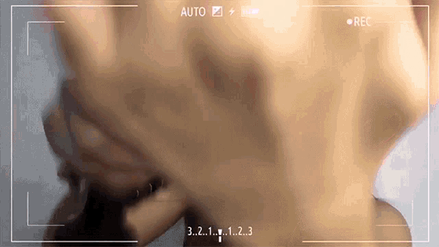 a recording of a person 's face with the numbers 3 2 1 and 1 2 3 on the screen