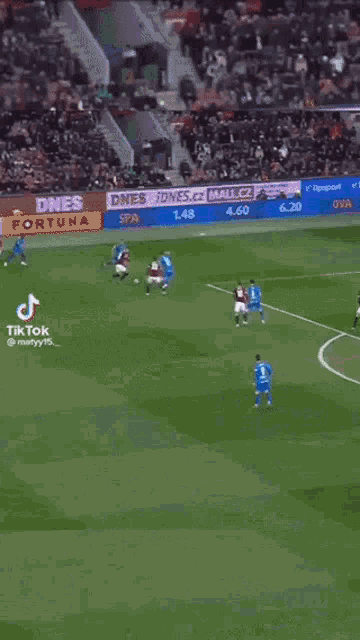 a soccer game is being played on a field with advertisements for tipsport