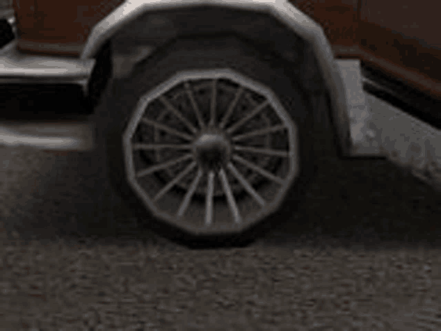 a close up of a wheel on a car on the road .