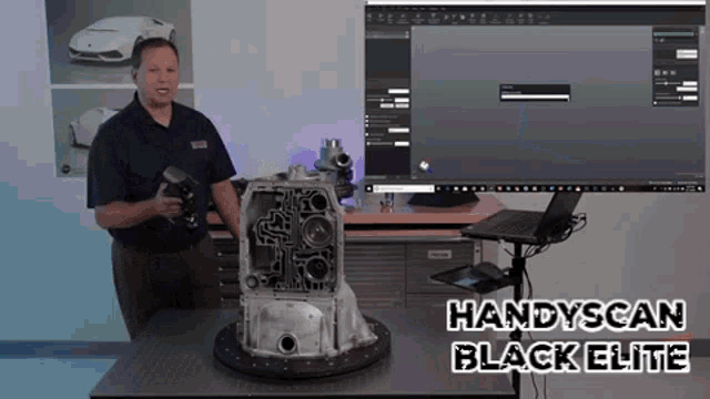 a man stands in front of a handyscan black elite